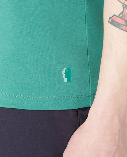 Man wearing a green Tapered Fit Cotton-Stretch T-Shirt