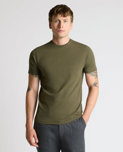Man wearing a green Cotton-Stretch Crew Neck T-Shirt
