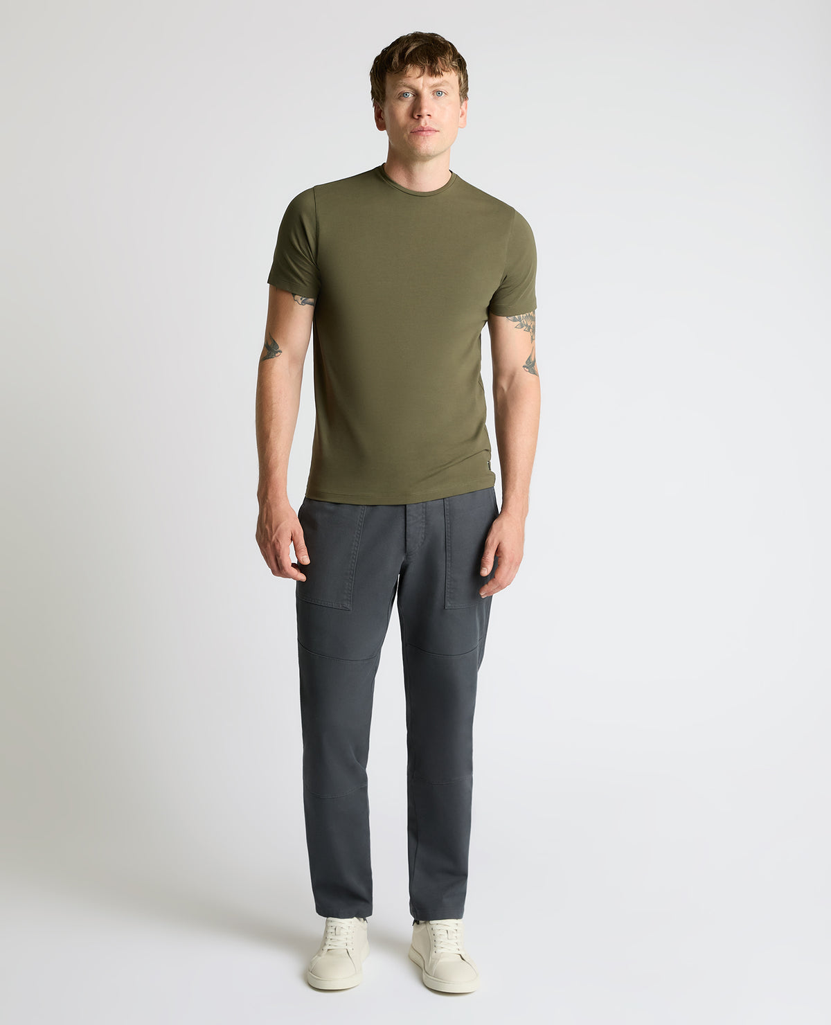 Man wearing a green Cotton-Stretch Crew Neck T-Shirt