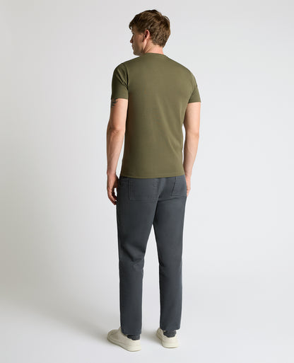 Man wearing a green Cotton-Stretch Crew Neck T-Shirt