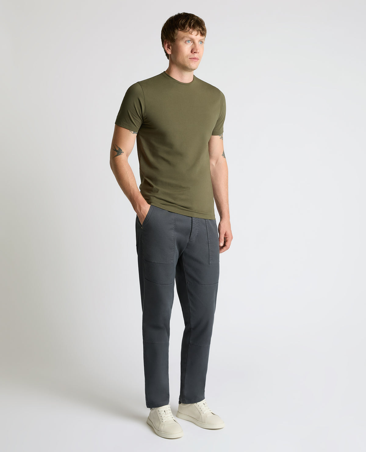 Man wearing a green Cotton-Stretch Crew Neck T-Shirt
