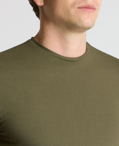Man wearing a green Cotton-Stretch Crew Neck T-Shirt