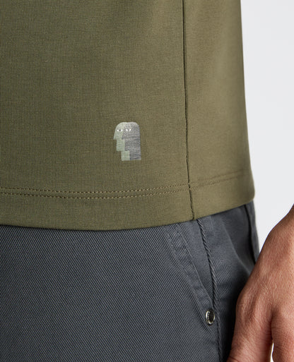 Man wearing a green Cotton-Stretch Crew Neck T-Shirt