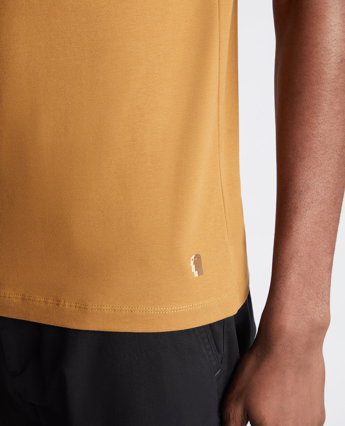 Man wearing a orange Tapered Fit Cotton-Stretch T-Shirt