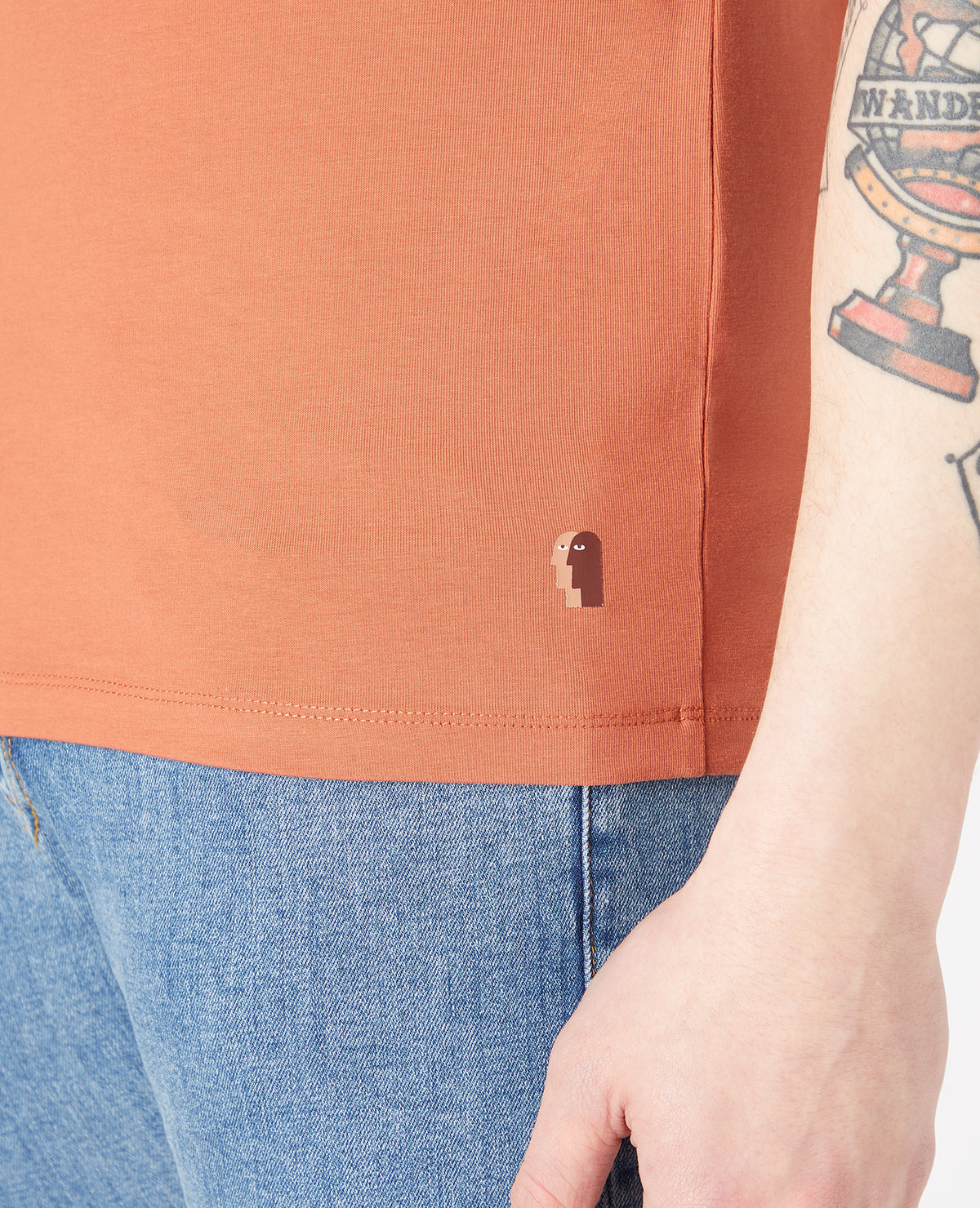 Man wearing a orange Tapered Fit Cotton-Stretch T-Shirt