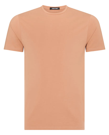 Man wearing a red Tapered Fit Cotton-Stretch T-Shirt