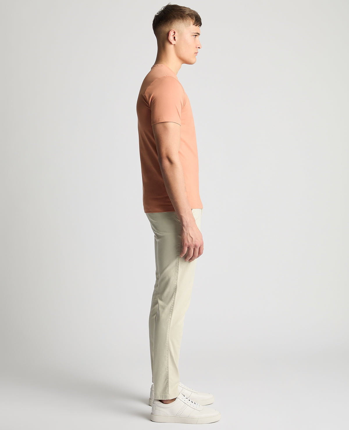 Man wearing a red Tapered Fit Cotton-Stretch T-Shirt