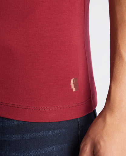 Man wearing a red Tapered Fit Cotton-Stretch T-Shirt