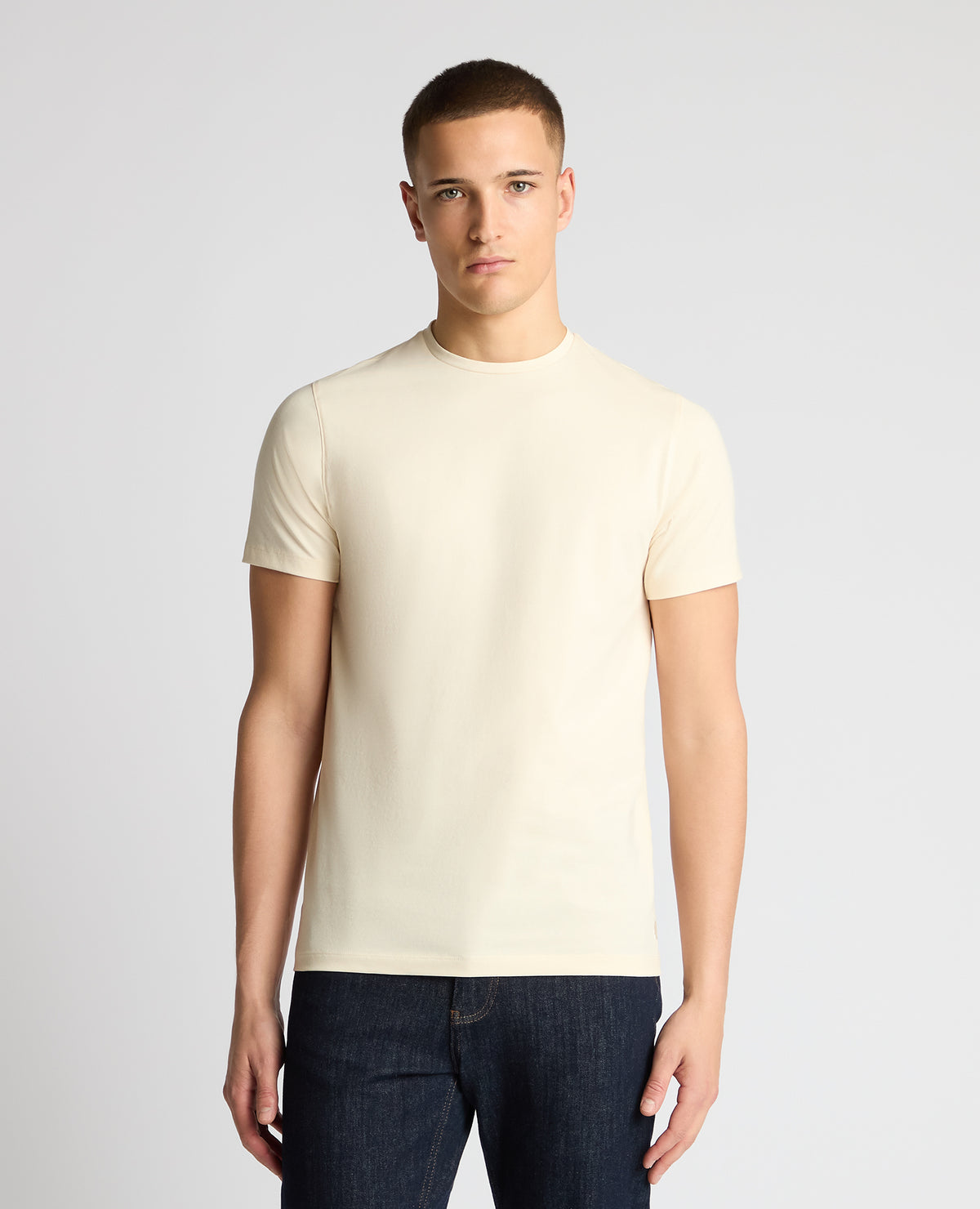 Man wearing a cream t-shirt