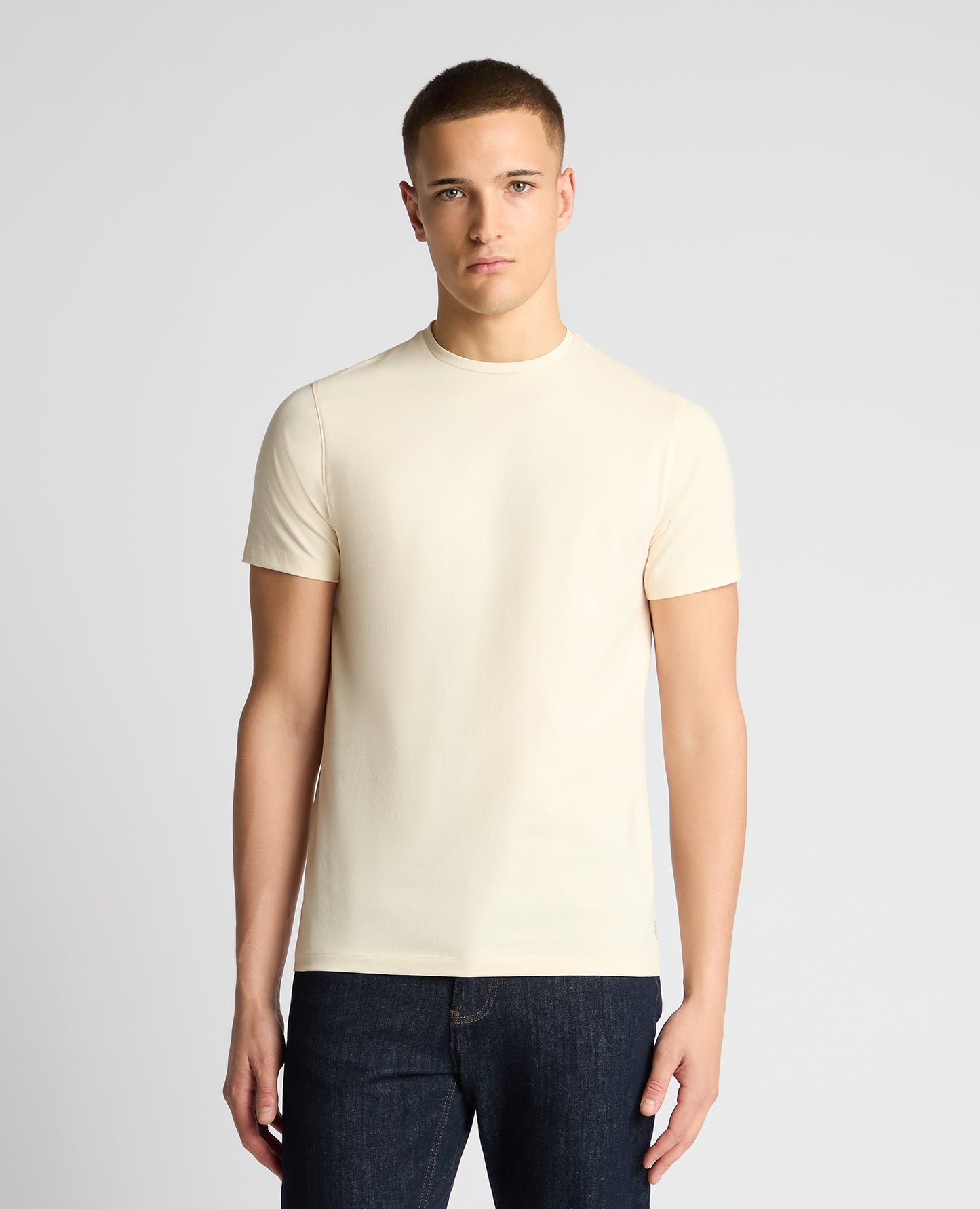 Man wearing a cream t-shirt