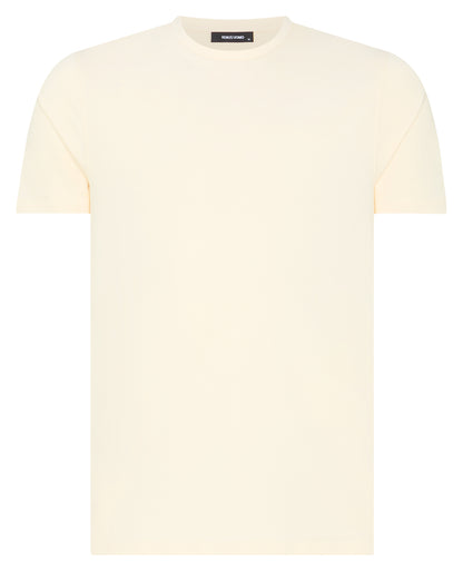 Man wearing a cream t-shirt