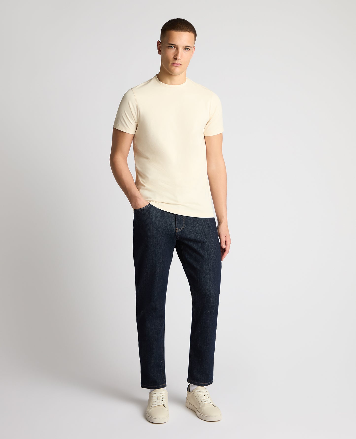 Man wearing a cream t-shirt