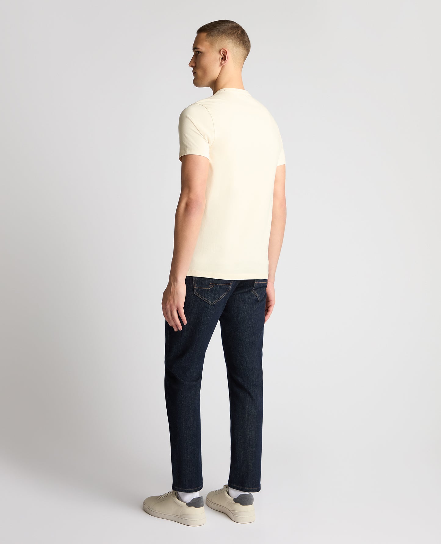 Man wearing a cream t-shirt