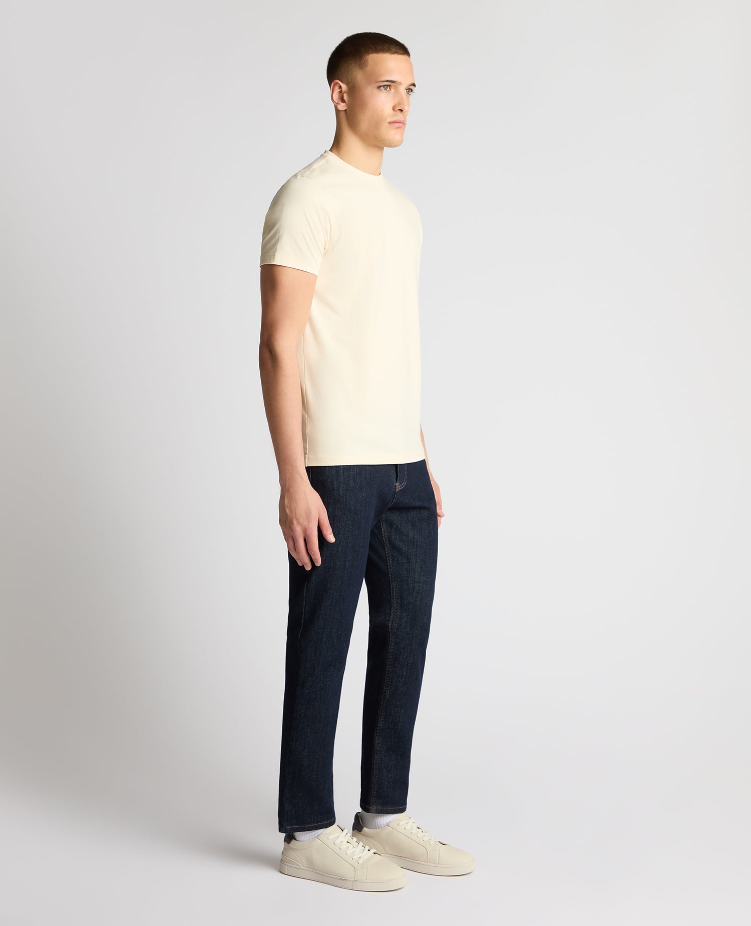 Man wearing a cream t-shirt
