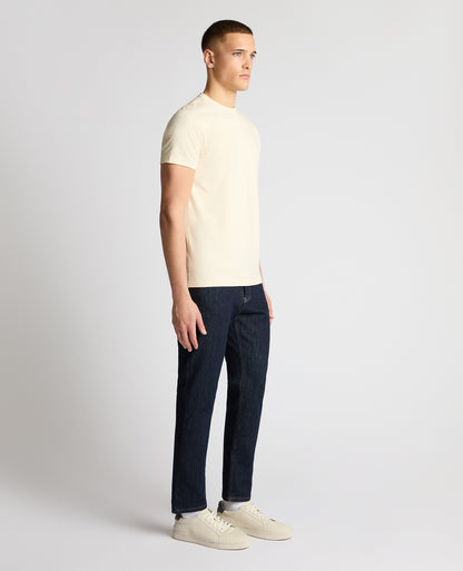 Man wearing a cream t-shirt