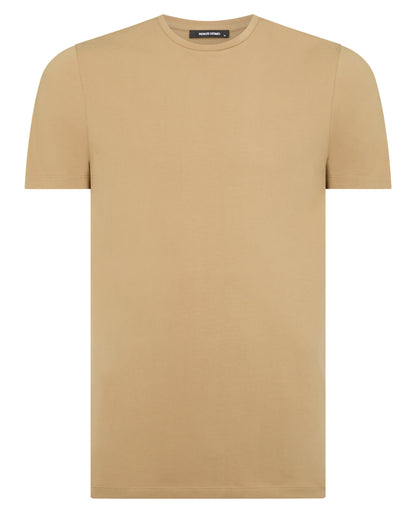 Man wearing a sand Tapered Fit Cotton-Stretch T-Shirt