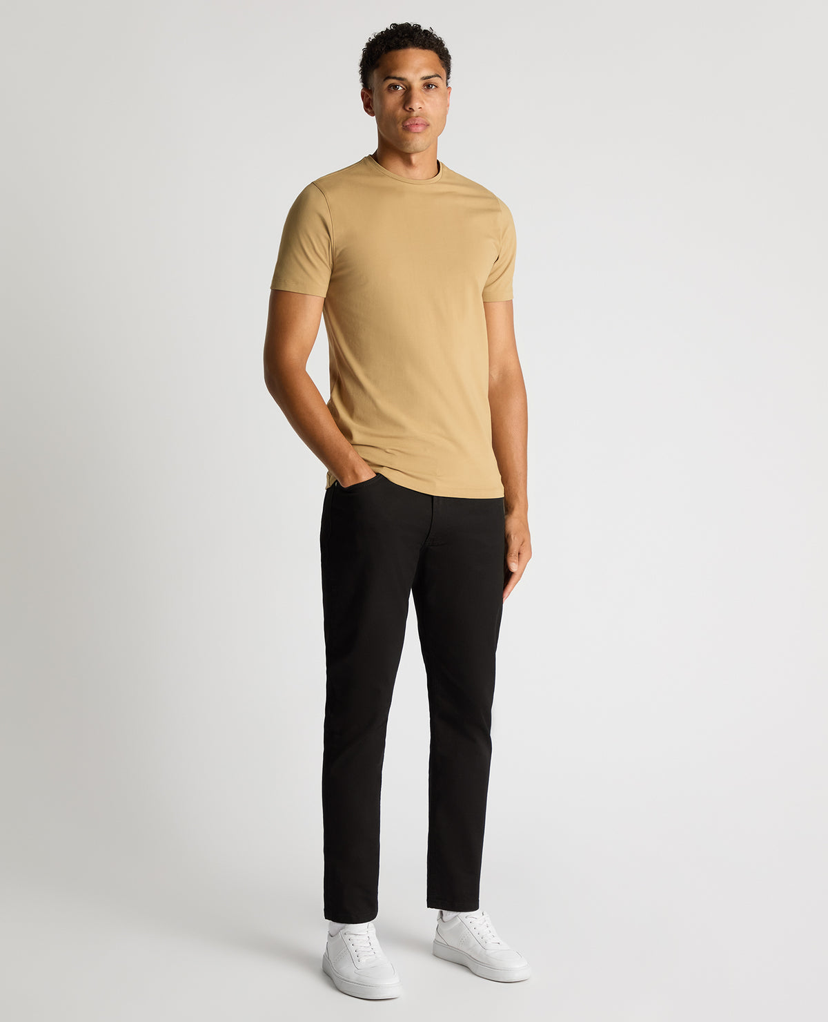 Man wearing a sand Tapered Fit Cotton-Stretch T-Shirt
