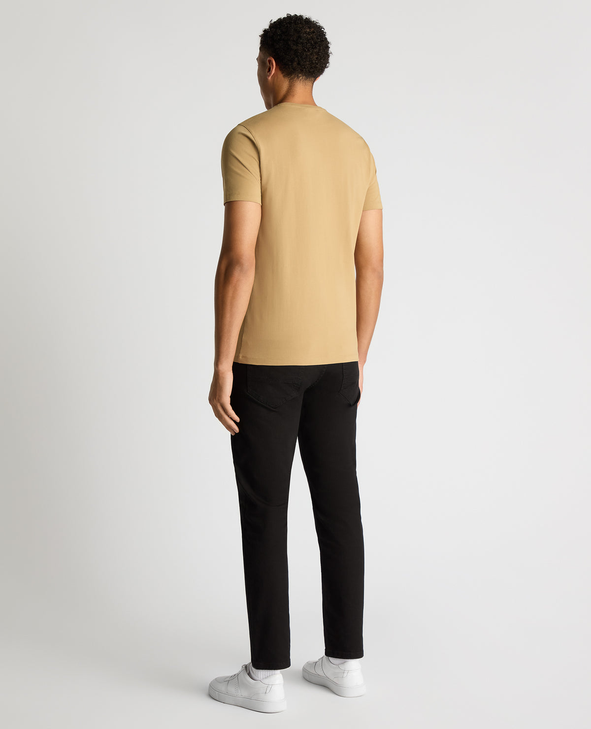 Man wearing a sand Tapered Fit Cotton-Stretch T-Shirt