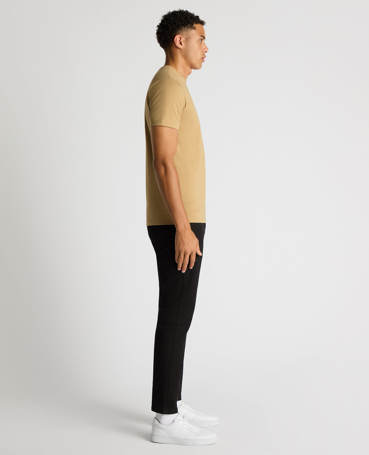 Man wearing a sand Tapered Fit Cotton-Stretch T-Shirt