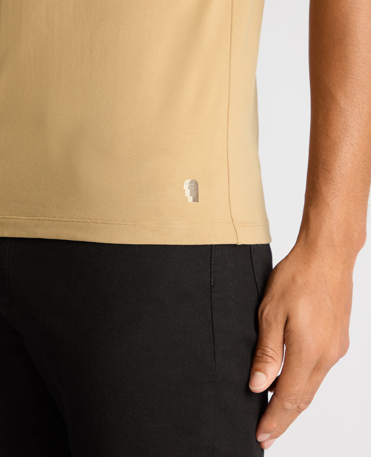 Man wearing a sand Tapered Fit Cotton-Stretch T-Shirt