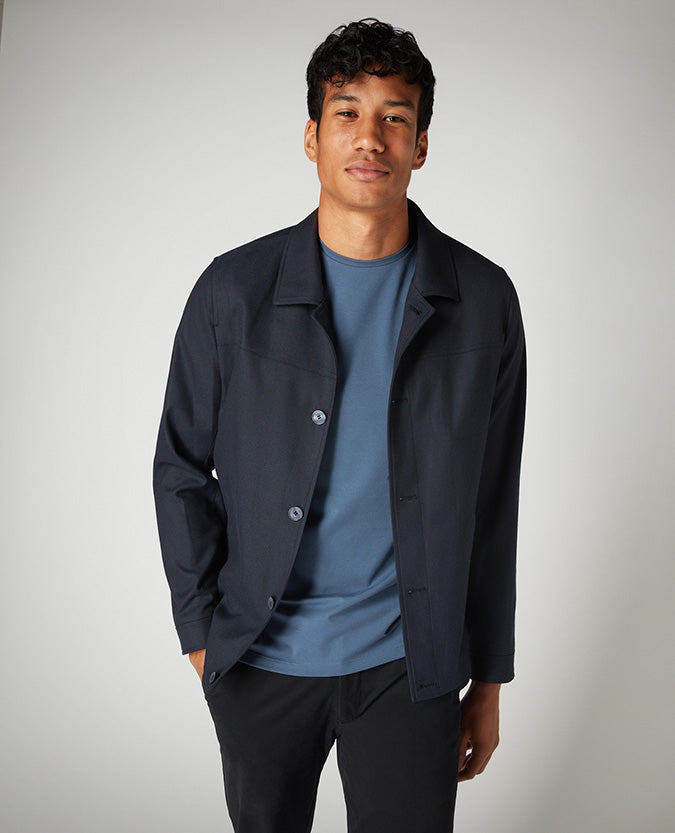 Man wearing a blue Tapered Fit Cotton-Stretch T-Shirt