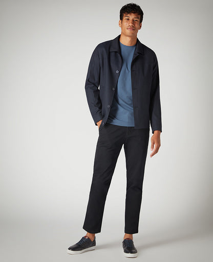 Man wearing a blue Tapered Fit Cotton-Stretch T-Shirt