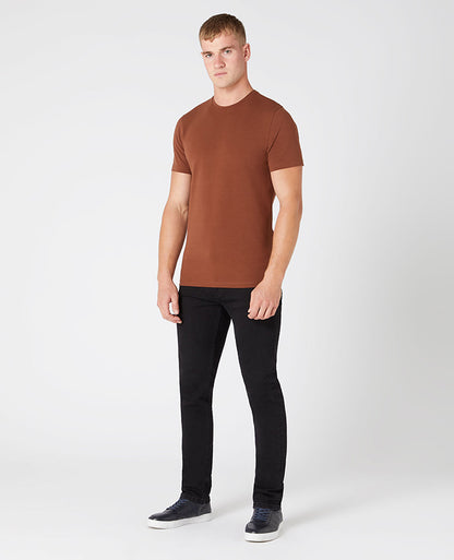 Man wearing a brown Tapered Fit Cotton-Stretch T-Shirt