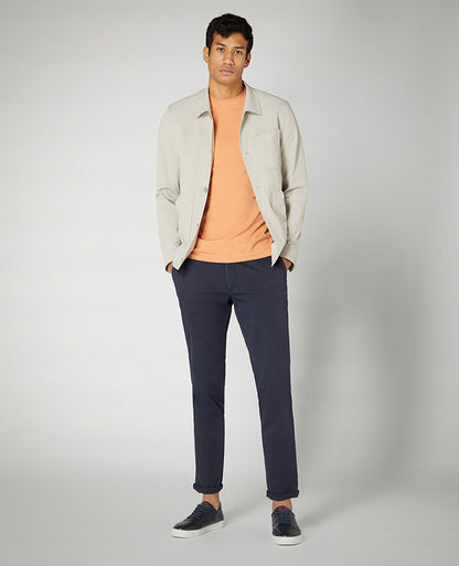 Man wearing a orange Tapered Fit Cotton-Stretch T-Shirt