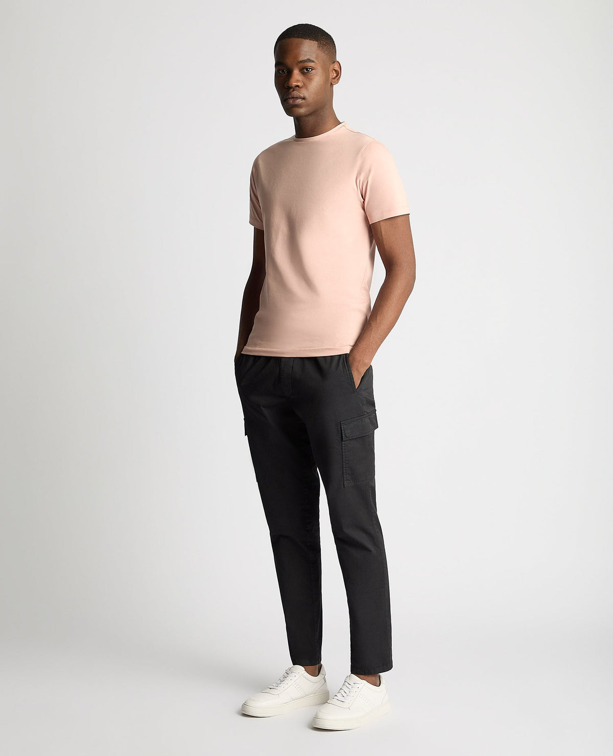 Man wearing a pink Tapered Fit Cotton-Stretch T-Shirt