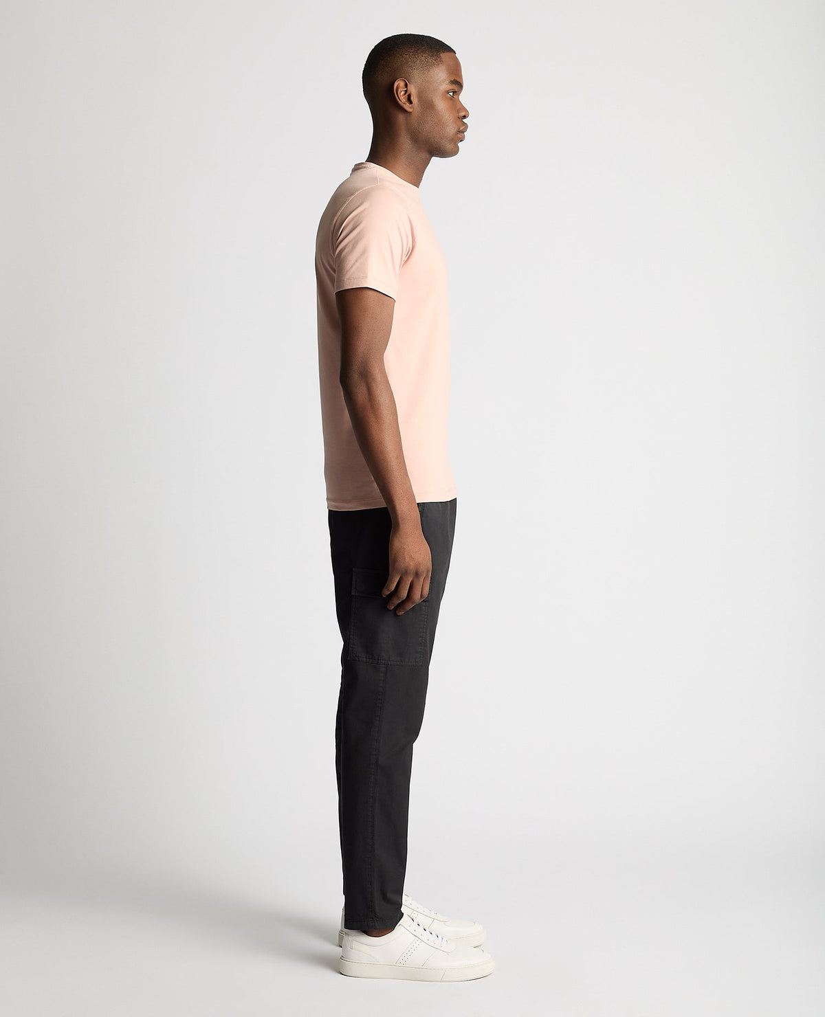 Man wearing a pink Tapered Fit Cotton-Stretch T-Shirt