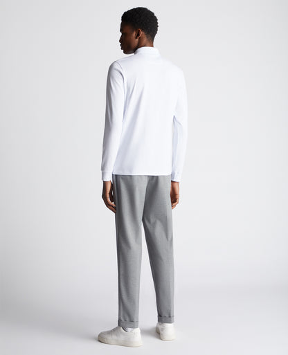 Man wearing a White polo shirt