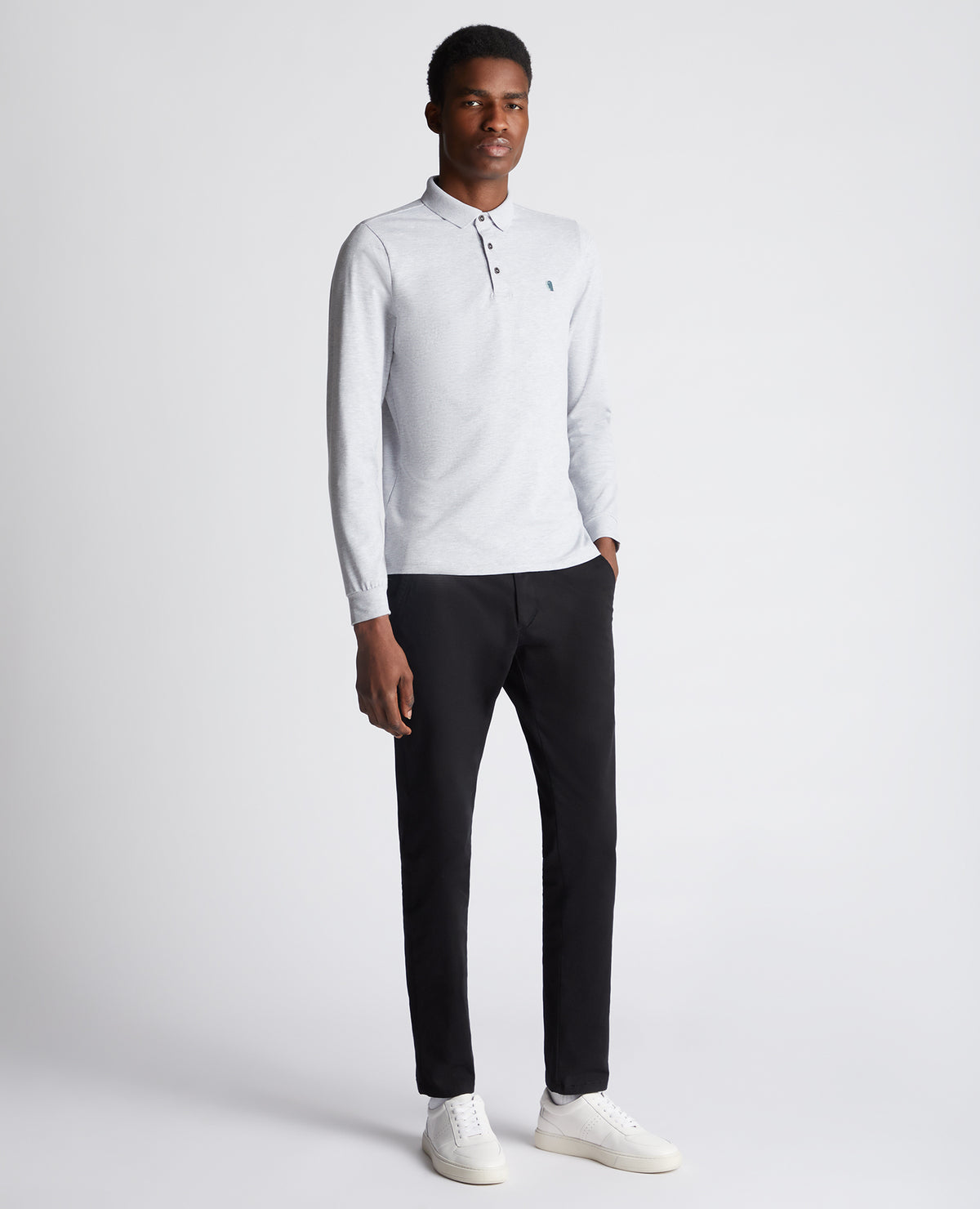 Man wearing a grey Tapered Fit Cotton-Stretch Long-Sleeve Polo Shirt