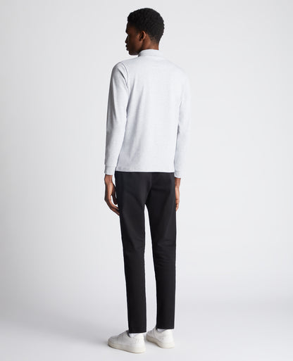 Man wearing a grey Tapered Fit Cotton-Stretch Long-Sleeve Polo Shirt