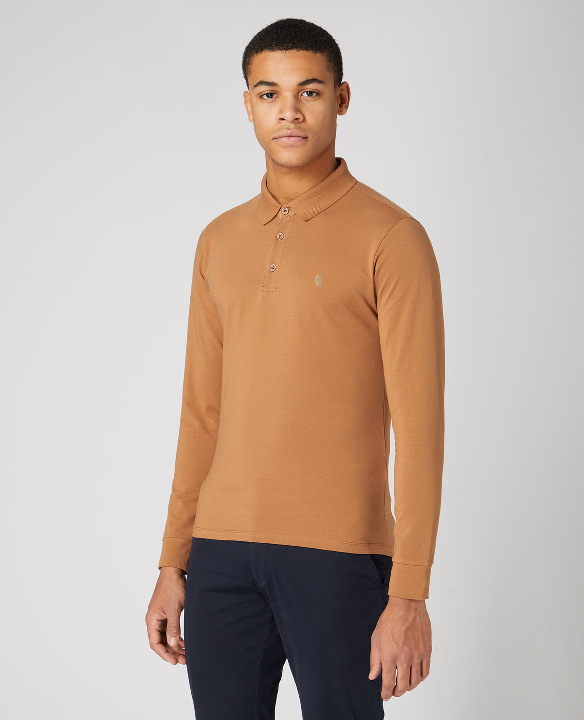 Man wearing a brown Tapered Fit Cotton-blend long seeve polo shirt