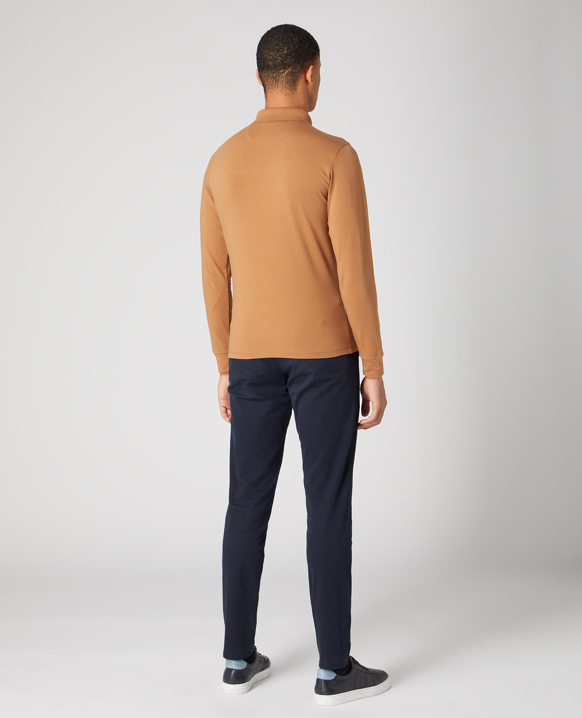 Man wearing a brown Tapered Fit Cotton-blend long seeve polo shirt