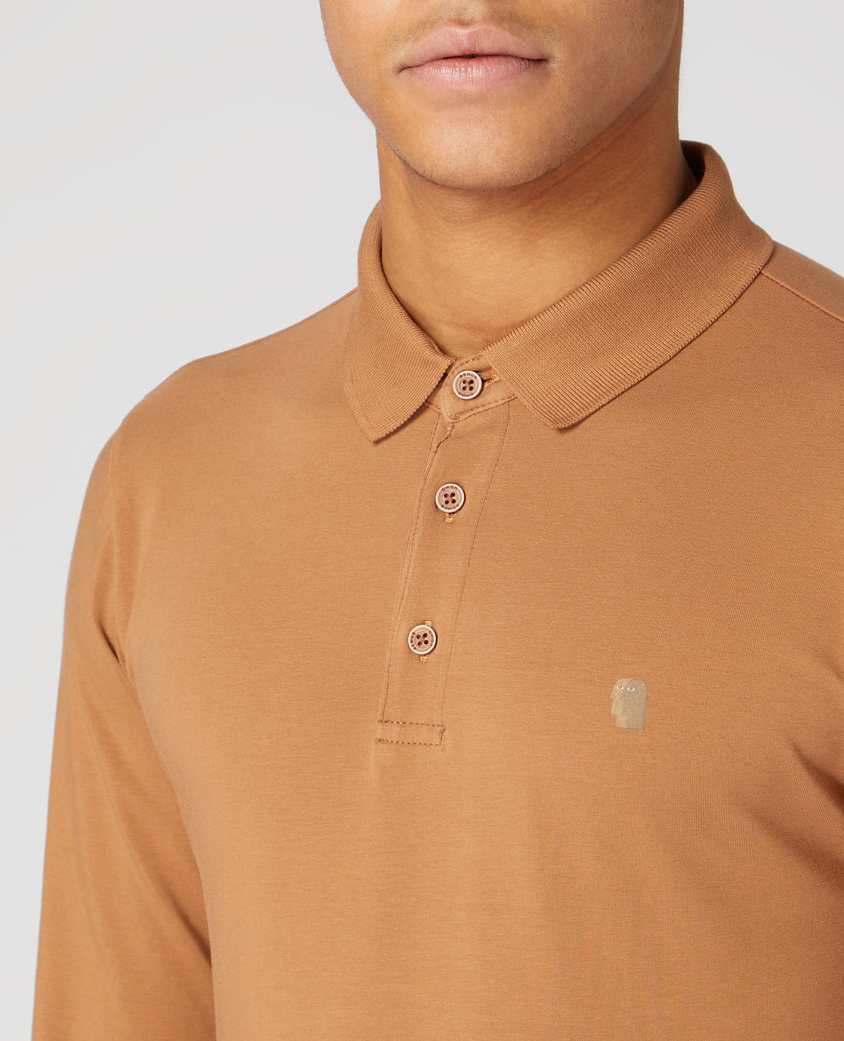 Man wearing a brown Tapered Fit Cotton-blend long seeve polo shirt