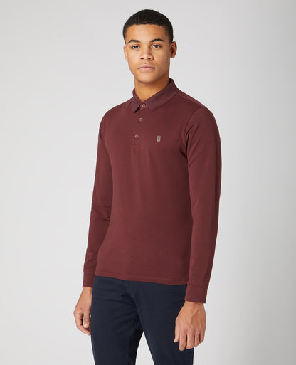 Man wearing a red Tapered Fit Cotton-Stretch Polo Shirt