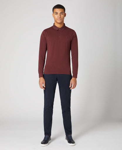 Man wearing a red Tapered Fit Cotton-Stretch Polo Shirt
