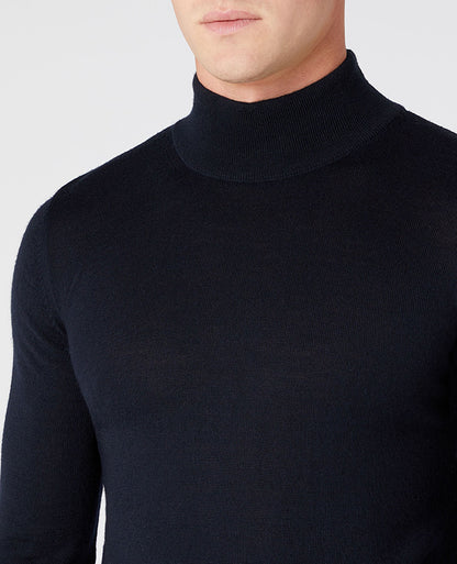Man wearing a navy Slim Fit Merino Wool-Blend Turtle Neck