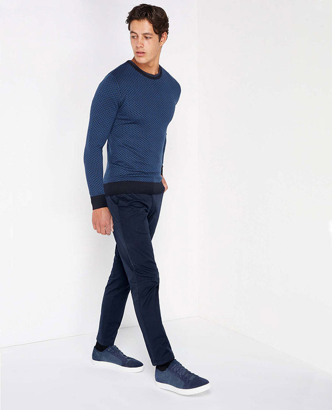 Man wearing a navy Slim Fit Merino Wool-Blend Crew Neck Sweater