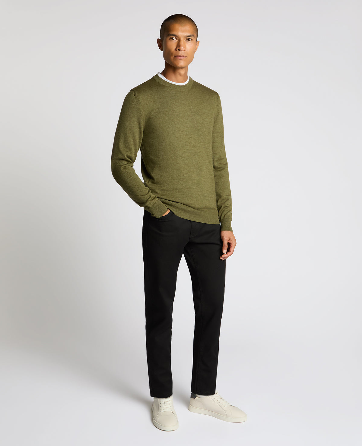 Man wearing a green Crew Neck Merino Wool-Blend Sweater