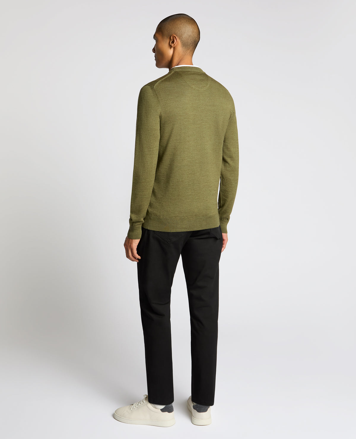 Man wearing a green Crew Neck Merino Wool-Blend Sweater