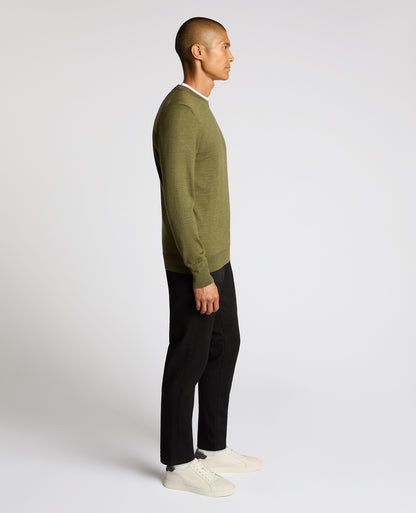 Man wearing a green Crew Neck Merino Wool-Blend Sweater
