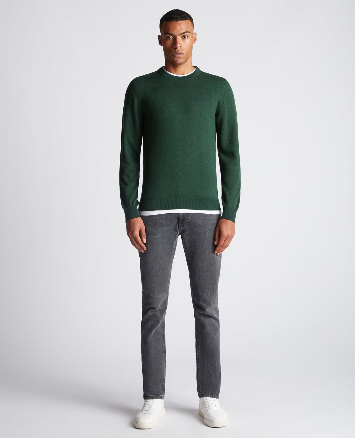 Man wearing a green Tapered Fit Merino Wool-Blend Crew Neck Sweater