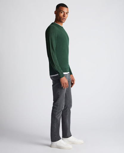 Man wearing a green Tapered Fit Merino Wool-Blend Crew Neck Sweater