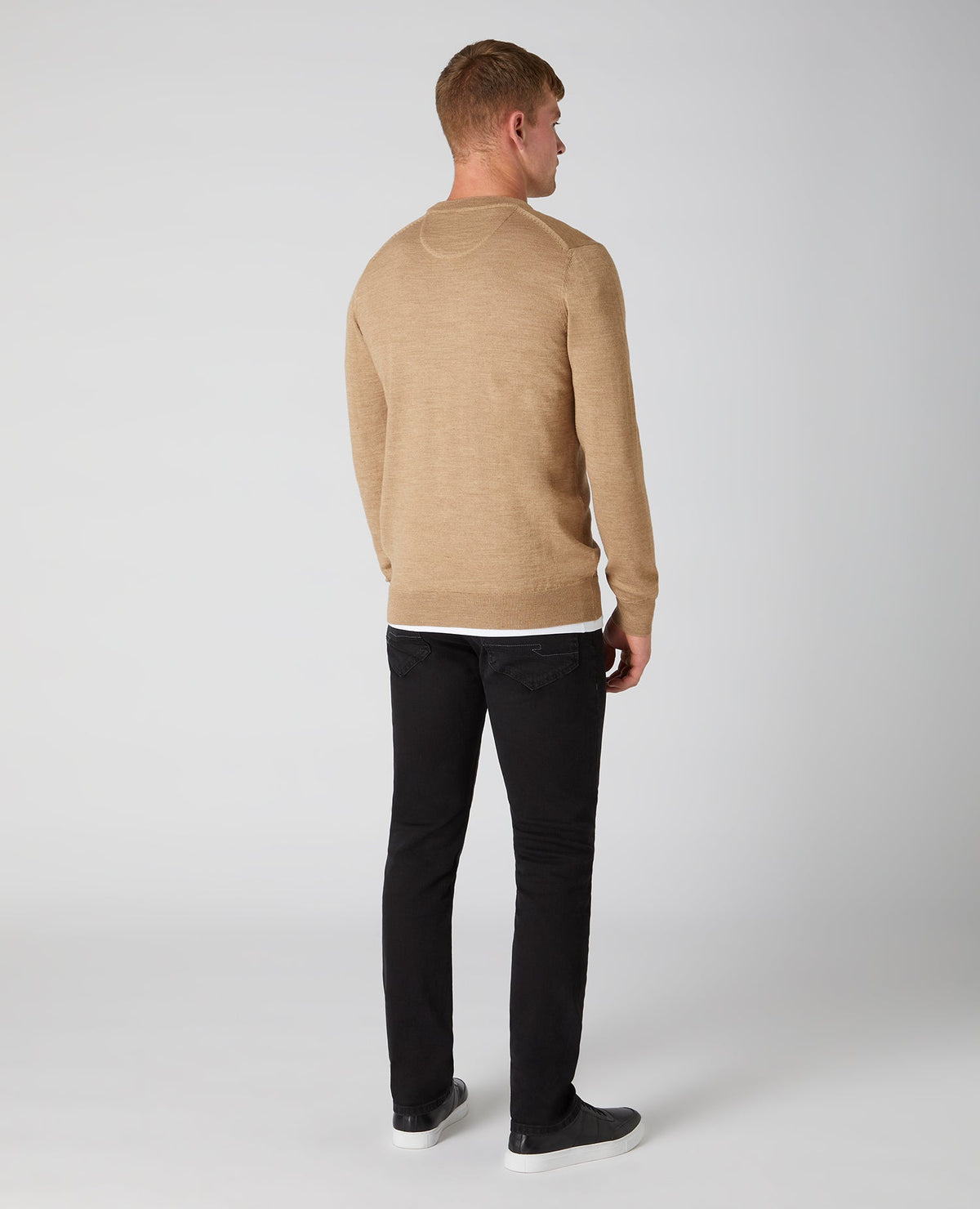 Man wearing a brown Tapered Fit Merino Wool-Blend Crew Neck Sweater