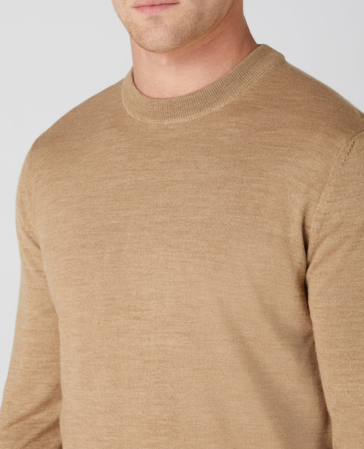 Man wearing a brown Tapered Fit Merino Wool-Blend Crew Neck Sweater