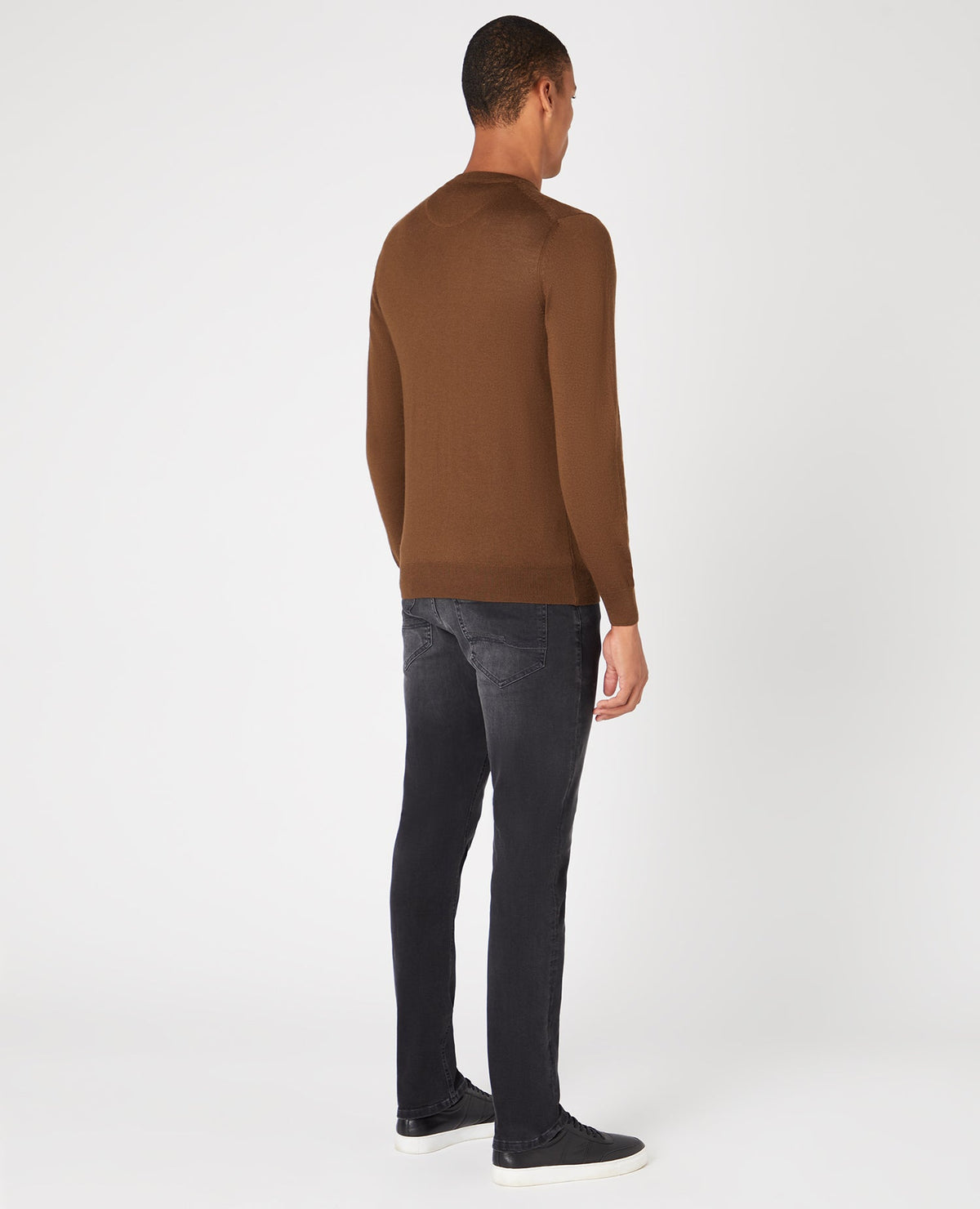 Man wearing a brown Tapered Fit Merino Wool-Acrylic Crew Neck Long Sleeve