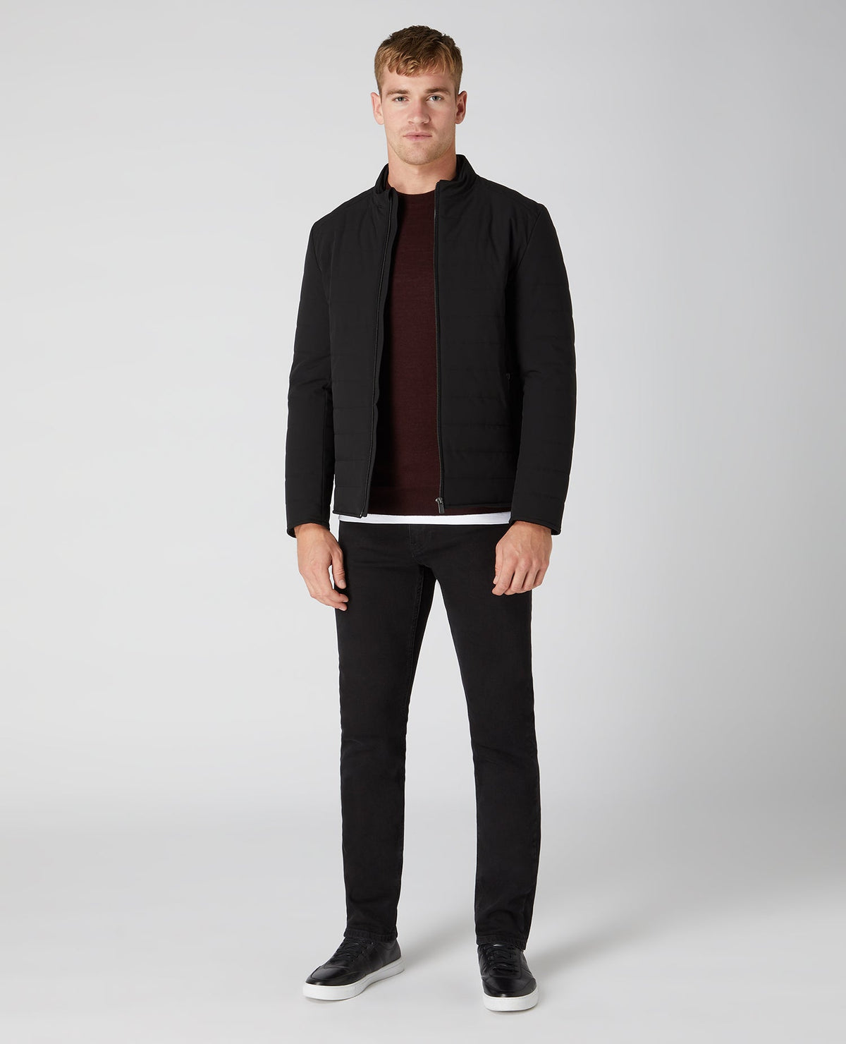 Man wearing a red Tapered Fit Merino Wool-Blend Crew Neck Sweater