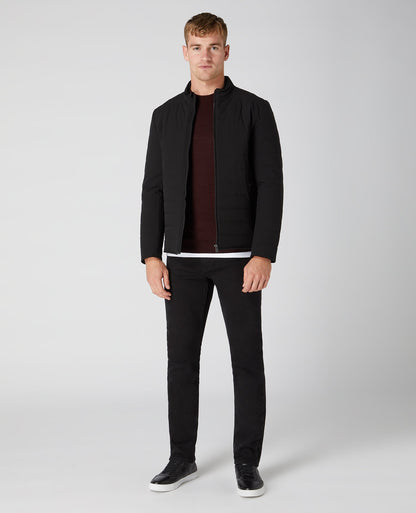 Man wearing a red Tapered Fit Merino Wool-Blend Crew Neck Sweater